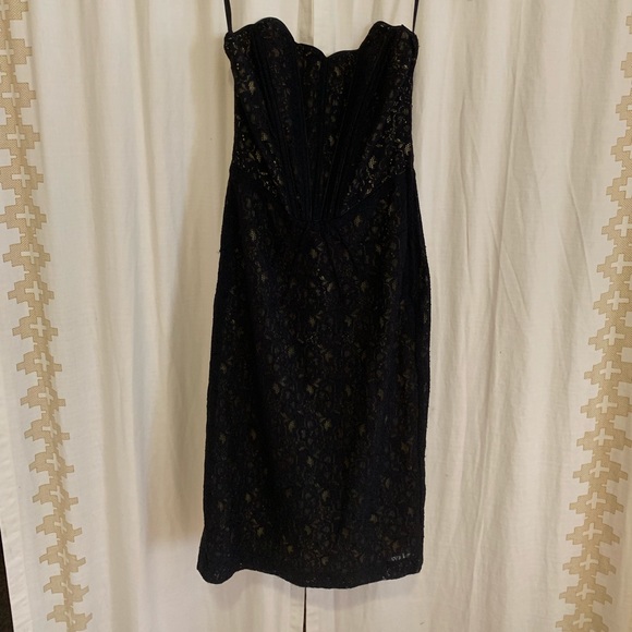 H&M Dresses & Skirts - Black  strapless lace dress. Lined in yellow.